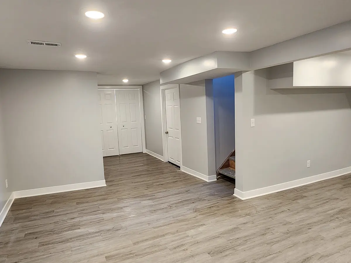 basement remodeling 2 after gray walls, white doors and wooden floor