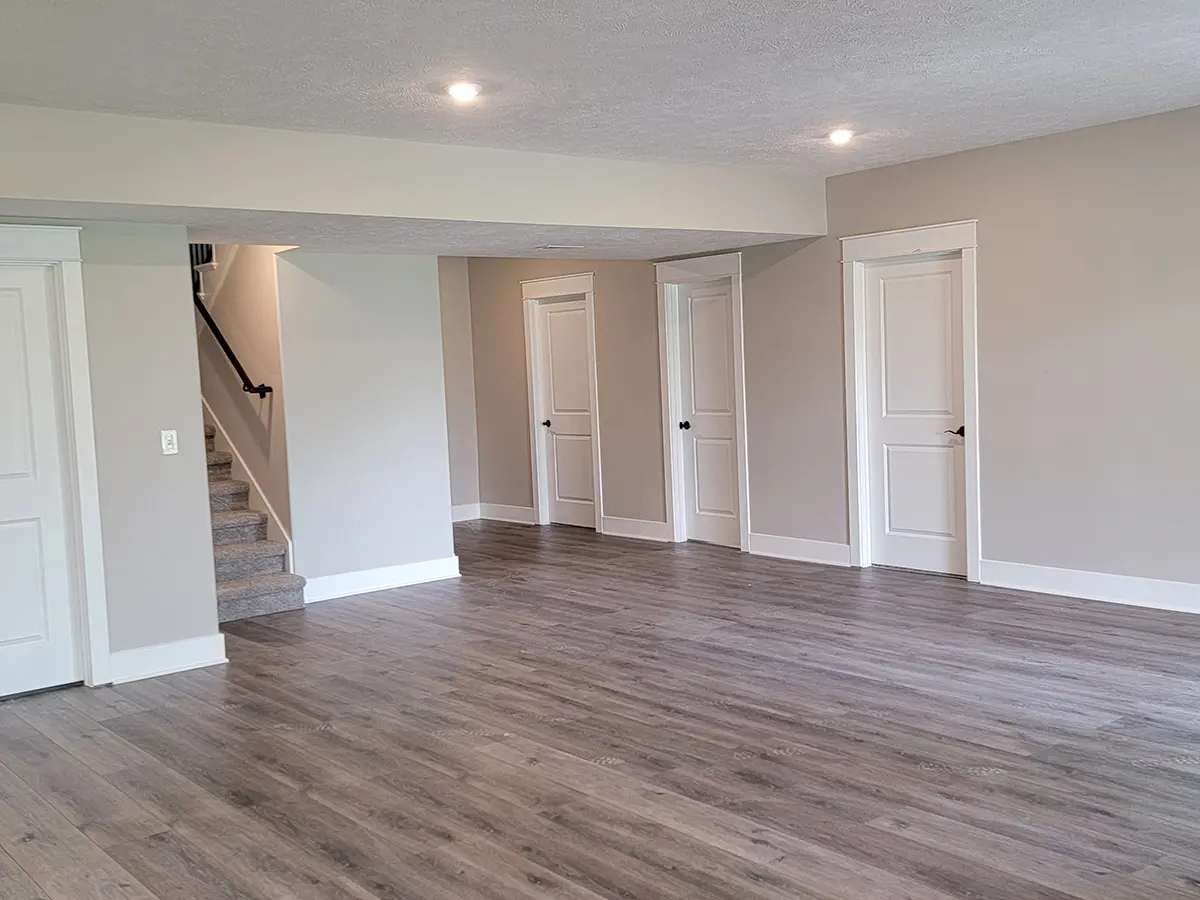 basement remodeling 3 after, white doors, gray walls, wooden floor