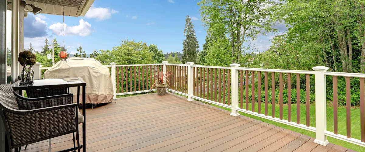 walk-out deck with patio area and a nature view
